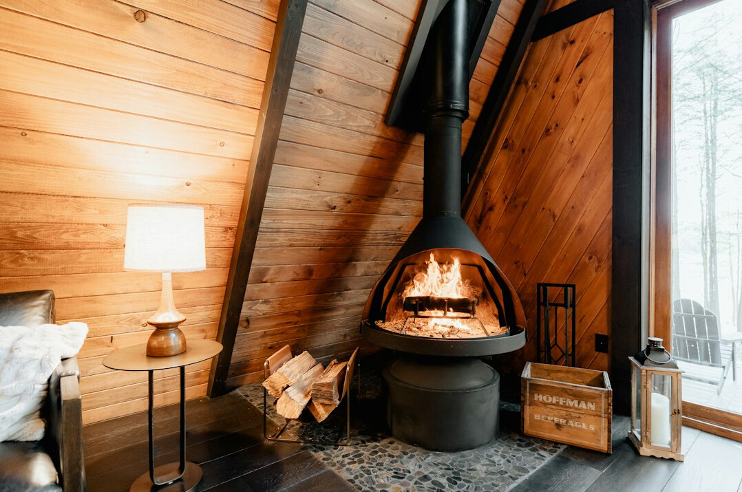 Elegant chalet living room with a stone fireplace and vintage furniture