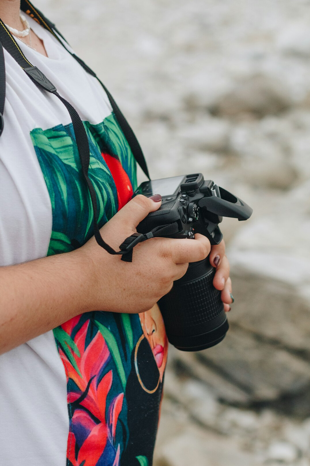 Woman photographer holding a DSLR camera