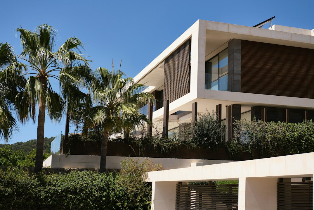 Modern villa facade with large windows and clean architectural lines
